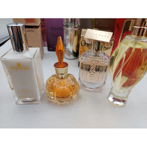 264 - A large collection of 24 designer perfumes mostly full and some still sealed. Brands to include, Cha... 