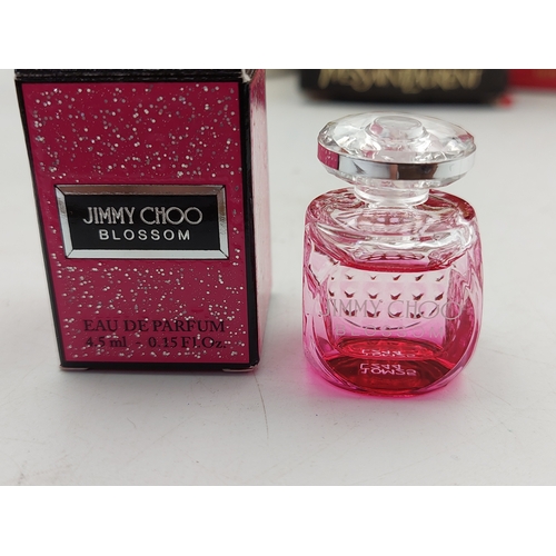 264 - A large collection of 24 designer perfumes mostly full and some still sealed. Brands to include, Cha... 