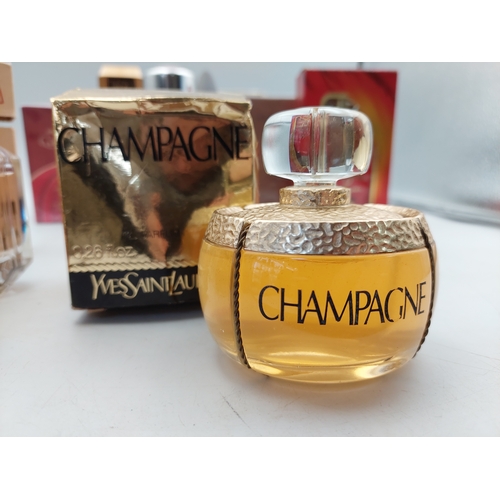 264 - A large collection of 24 designer perfumes mostly full and some still sealed. Brands to include, Cha... 