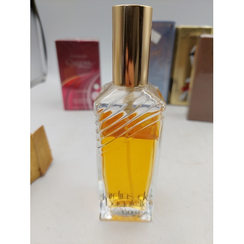 264 - A large collection of 24 designer perfumes mostly full and some still sealed. Brands to include, Cha... 