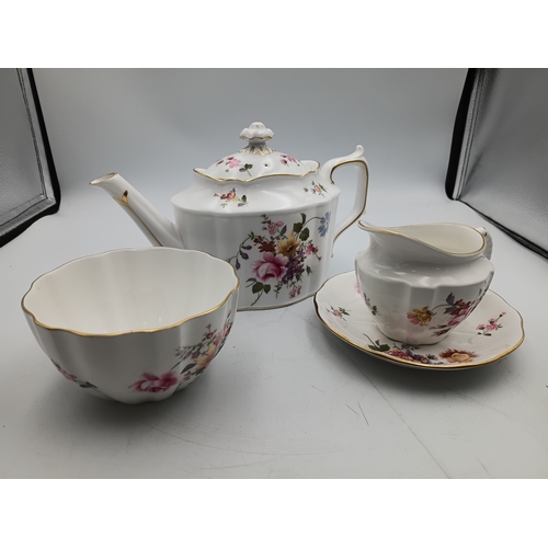 276 - A Royal Crown Derby Tea set. To include, 8 teacups, 1 teapot, 1 milk jug, 1 sandwich plate, 3 plates... 