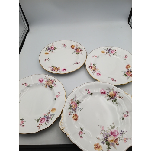 276 - A Royal Crown Derby Tea set. To include, 8 teacups, 1 teapot, 1 milk jug, 1 sandwich plate, 3 plates... 