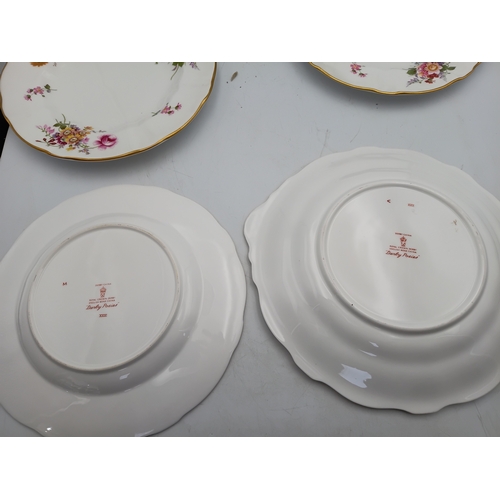 276 - A Royal Crown Derby Tea set. To include, 8 teacups, 1 teapot, 1 milk jug, 1 sandwich plate, 3 plates... 