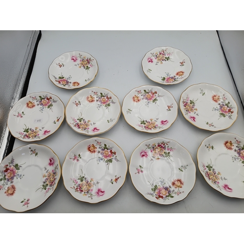 276 - A Royal Crown Derby Tea set. To include, 8 teacups, 1 teapot, 1 milk jug, 1 sandwich plate, 3 plates... 