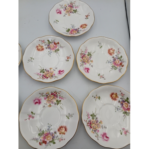 276 - A Royal Crown Derby Tea set. To include, 8 teacups, 1 teapot, 1 milk jug, 1 sandwich plate, 3 plates... 