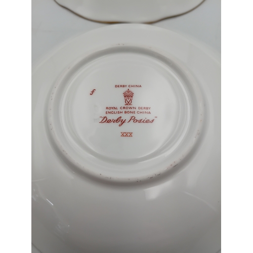 276 - A Royal Crown Derby Tea set. To include, 8 teacups, 1 teapot, 1 milk jug, 1 sandwich plate, 3 plates... 
