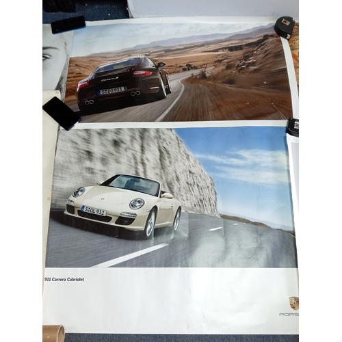 217 - A job lot of posters, to include; 3x genuine PORSCHE 911 posters (100cm x 75cm), an aboriginal style... 