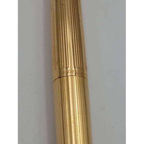 220 - A vintage sheafer fountain pen with a 14k gold nib.