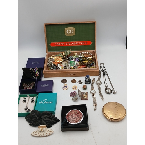 222 - A collection of jewellery in a Corps Diplomatique cigar box. Jewellery includes, watches, brooches, ... 