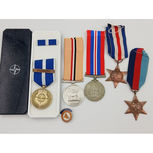 224 - A collection of medals. To include, the france and germany star, the 1939-1945 star, a replica Iraq ... 