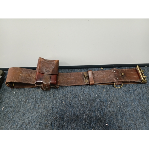 225 - A Sam brown belt with a magazine pouch, a West German commando knife, and 2 other knives in sheaths.