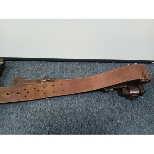 225 - A Sam brown belt with a magazine pouch, a West German commando knife, and 2 other knives in sheaths.