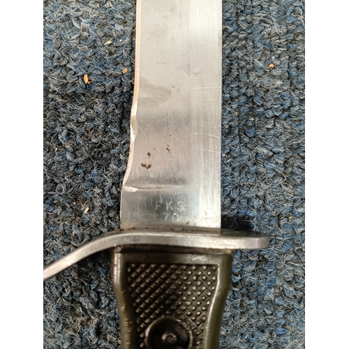 225 - A Sam brown belt with a magazine pouch, a West German commando knife, and 2 other knives in sheaths.