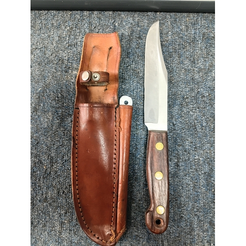 225 - A Sam brown belt with a magazine pouch, a West German commando knife, and 2 other knives in sheaths.