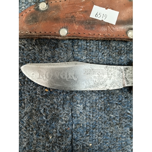 225 - A Sam brown belt with a magazine pouch, a West German commando knife, and 2 other knives in sheaths.
