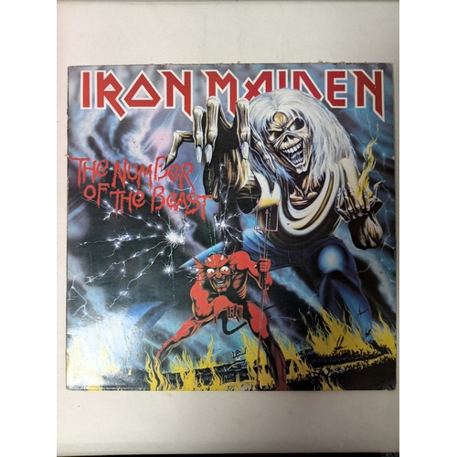 Iron Maiden The Number of The Beast vinyl record in very good condition with cover as shown. Possibly signed by Adrian Smith