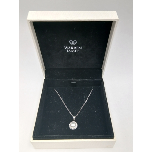 397 - A stamped 925 silver necklace with a stamped 925 silver pendant. Length 18 inches