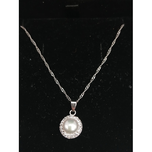 397 - A stamped 925 silver necklace with a stamped 925 silver pendant. Length 18 inches