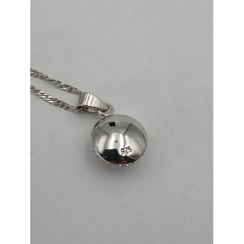 397 - A stamped 925 silver necklace with a stamped 925 silver pendant. Length 18 inches
