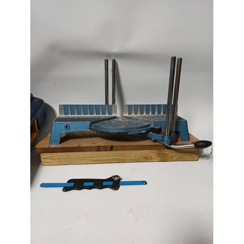 87 - A MacAllister tile cutting machine pat tested and working, plus a saw, a mitre box, and a saw clamp.