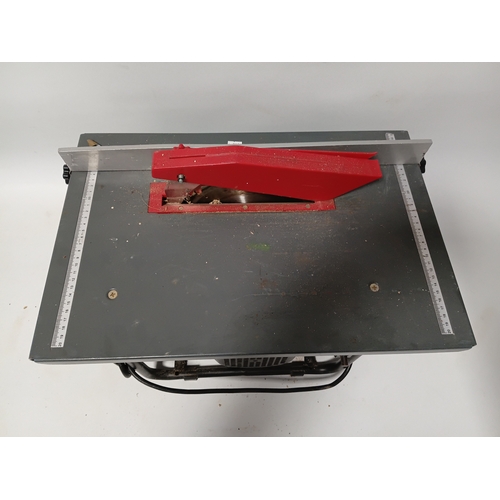 88 - A bench saw, pat tested and working. Height 10 inches x width 20 inches x depth 13 inches.