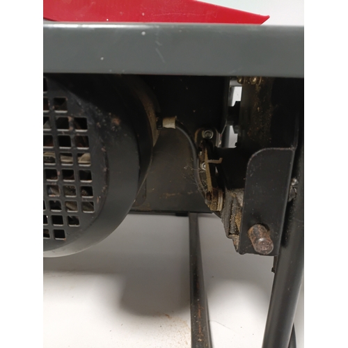 88 - A bench saw, pat tested and working. Height 10 inches x width 20 inches x depth 13 inches.