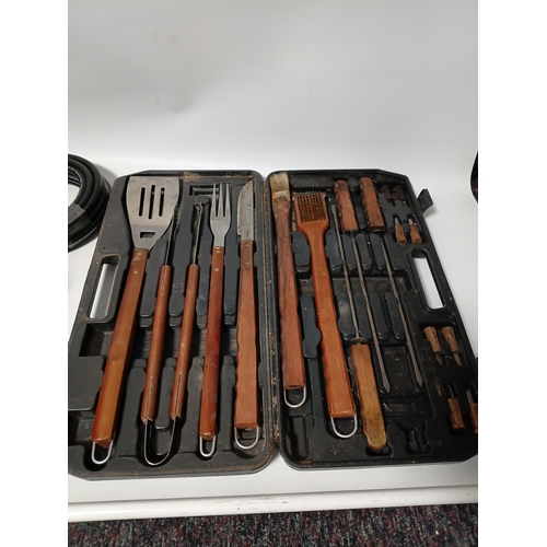 89 - A large collection of gardening equipment, to include a barbecue set, gloves, hard hat, Danish oil a... 