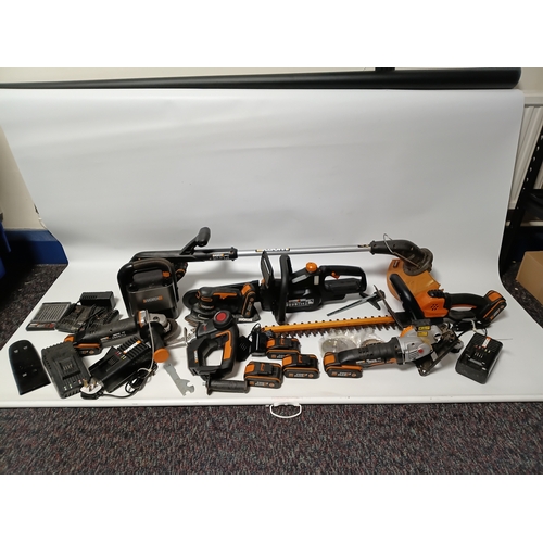90 - A large collection Worx power tools to include a strimmer, hedge cutter, angle grinder, chainsaw, sa... 