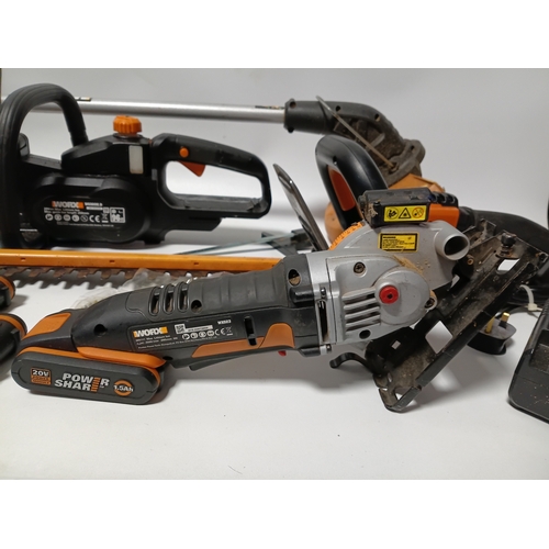 90 - A large collection Worx power tools to include a strimmer, hedge cutter, angle grinder, chainsaw, sa... 