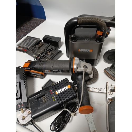 90 - A large collection Worx power tools to include a strimmer, hedge cutter, angle grinder, chainsaw, sa... 