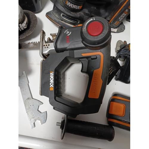 90 - A large collection Worx power tools to include a strimmer, hedge cutter, angle grinder, chainsaw, sa... 