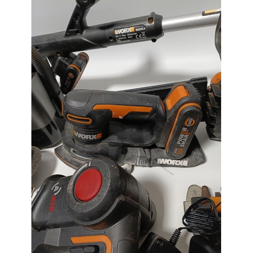 90 - A large collection Worx power tools to include a strimmer, hedge cutter, angle grinder, chainsaw, sa... 