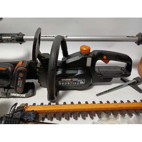90 - A large collection Worx power tools to include a strimmer, hedge cutter, angle grinder, chainsaw, sa... 