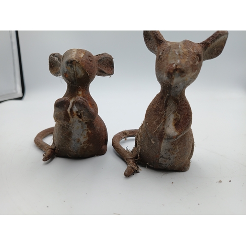 91 - A collection of small vintage cast iron garden ornaments to include, a pair of mice, a pair of birds... 