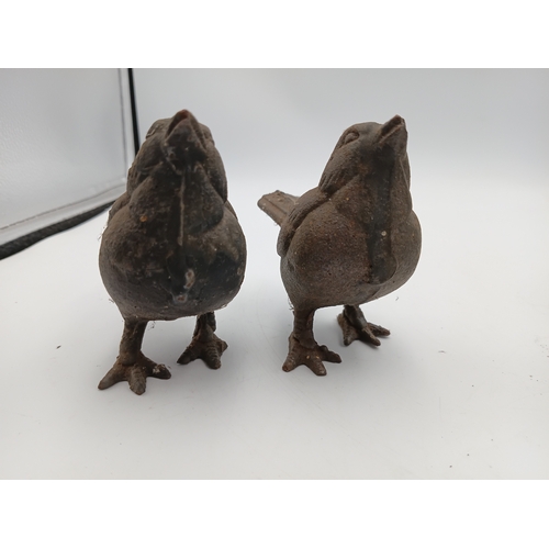 91 - A collection of small vintage cast iron garden ornaments to include, a pair of mice, a pair of birds... 