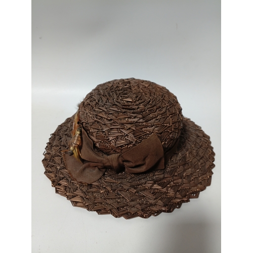 277 - A collection of 4 straw hats to include colours such as, white and brown.