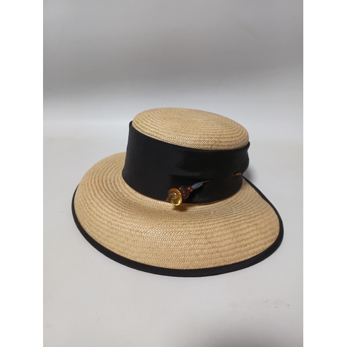 277 - A collection of 4 straw hats to include colours such as, white and brown.
