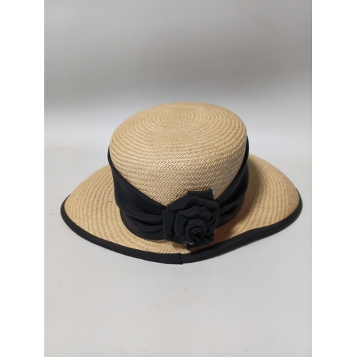 277 - A collection of 4 straw hats to include colours such as, white and brown.