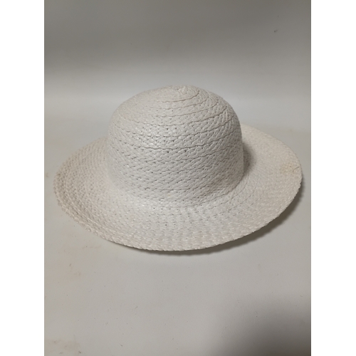 277 - A collection of 4 straw hats to include colours such as, white and brown.