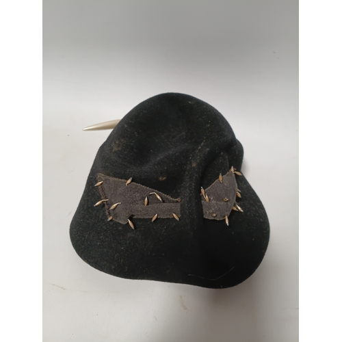 279 - A 1920s style Past Times white straw cloche hat and a black felt hat with seed pearls and black brai... 