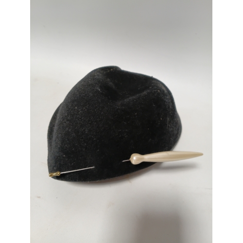279 - A 1920s style Past Times white straw cloche hat and a black felt hat with seed pearls and black brai... 