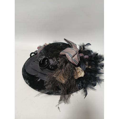 281 - A vintage-style decorative hat featuring black feathers and a striped bow plus a matching bag.