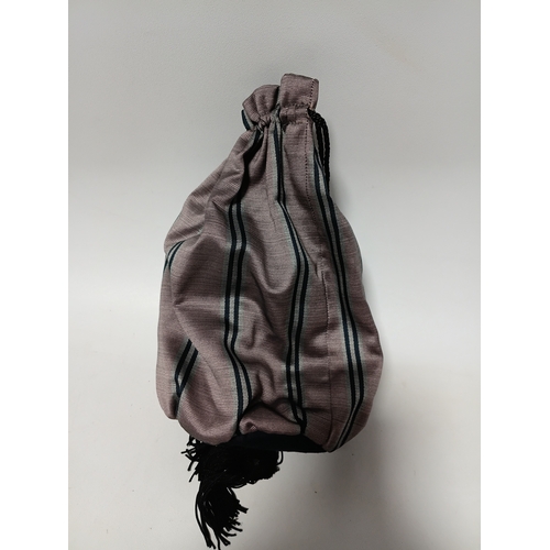 281 - A vintage-style decorative hat featuring black feathers and a striped bow plus a matching bag.