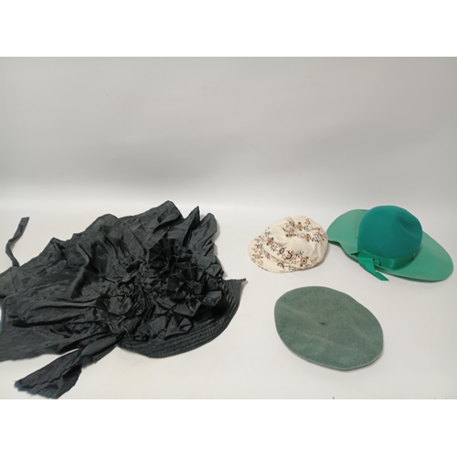 282 - A collection of 4 hats, to include, a white embroidered cap featuring a floral pattern,  a green fel... 