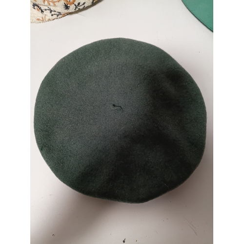 282 - A collection of 4 hats, to include, a white embroidered cap featuring a floral pattern,  a green fel... 