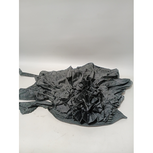 282 - A collection of 4 hats, to include, a white embroidered cap featuring a floral pattern,  a green fel... 