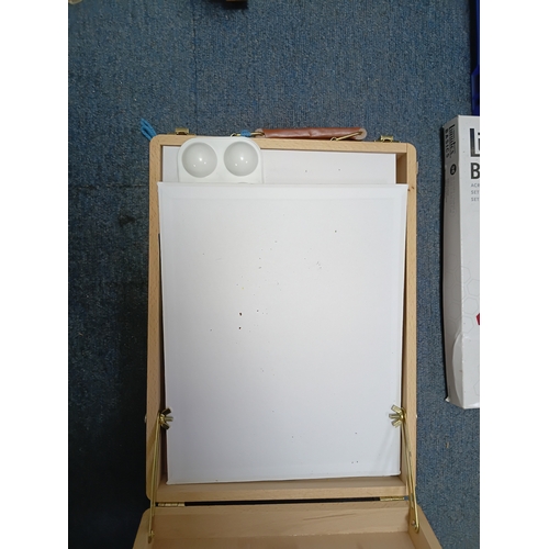 99 - A collection of artists equipment to include, a canvas 24 inches by 36 inches, 36 acrylic colour set... 
