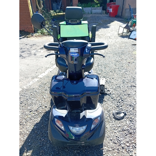 94 - An Invacare comet mobility scooter missing the key, with battery charger from a house clearance but ... 