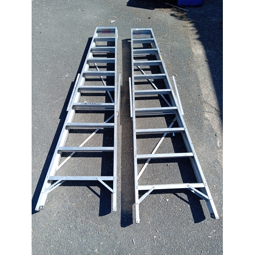 96 - A pair of Titan step / swing-back ladders. (Height 87 inches x total length 106 inches)