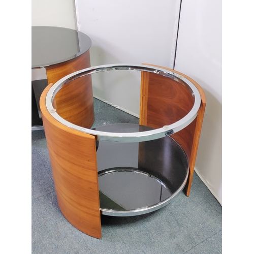 121 - A pair of mid-century teak bentwood side tables with chrome accents and glass top - Circular table m... 
